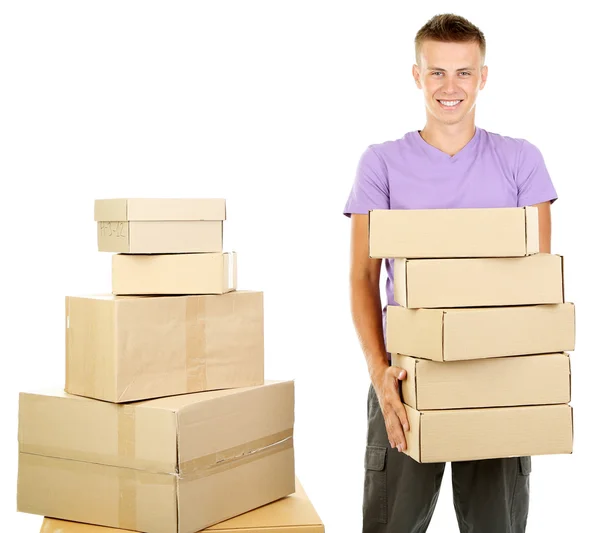 Joven repartidor con paquetes, aislado en blanco — Foto de Stock