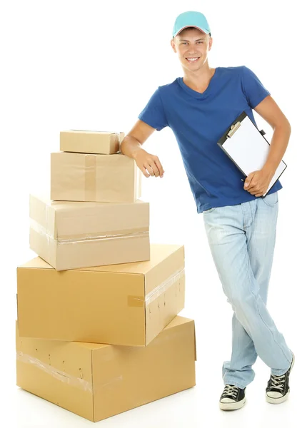 Young delivery man with parcels and clipboard, isolated on white — Stock Photo, Image