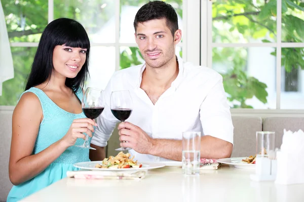 Beautiful young couple at restaurant — Stock Photo, Image