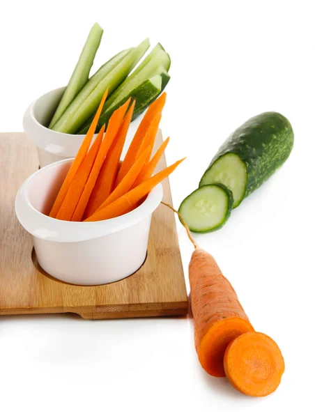 Bright fresh vegetables cut up slices in bowls isolated on white — Stock Photo, Image