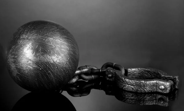 Ball and chain on grey background — Stock Photo, Image