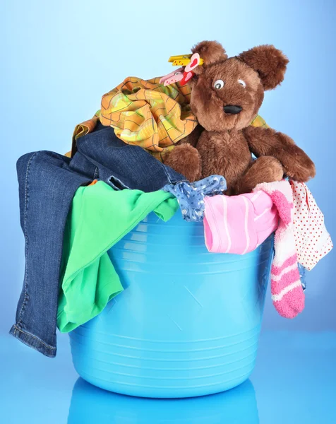 Laundry basket on blue background — Stock Photo, Image