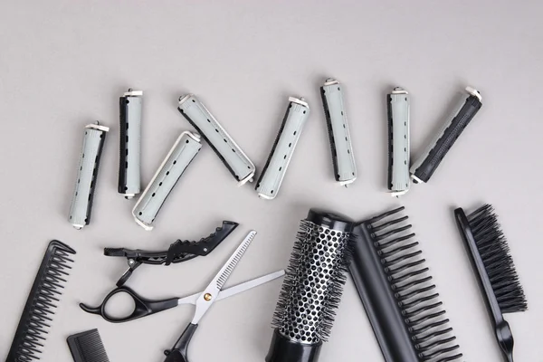 Professional hairdresser tools on gray background — Stock Photo, Image