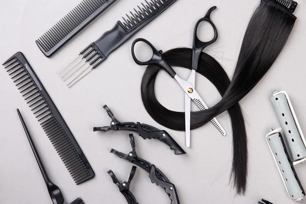 Professional hairdresser tools on gray background — Stock Photo, Image