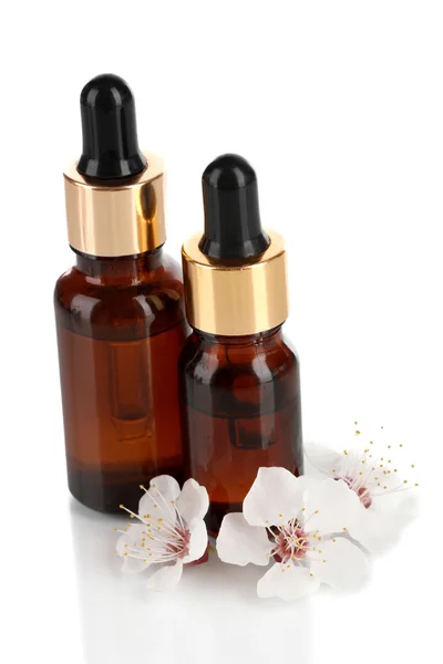 Aroma oils with flowers isolated on white — Stock Photo, Image