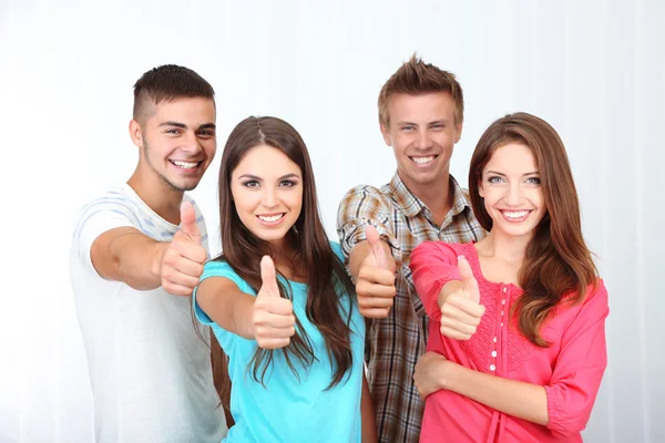 Group of happy beautiful young people at room — Stock Photo, Image