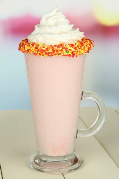 Delicious milk shake on table on light background — Stock Photo, Image