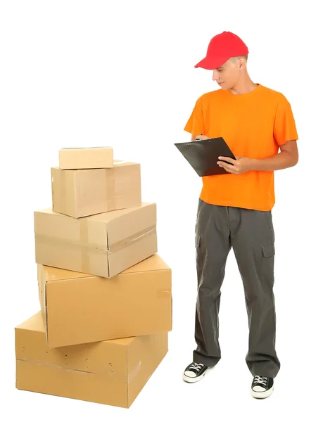 Young delivery man with parcels and clipboard, isolated on white — Stock Photo, Image