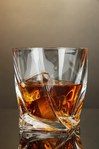 Glass of whiskey, on dark background — Stock Photo, Image