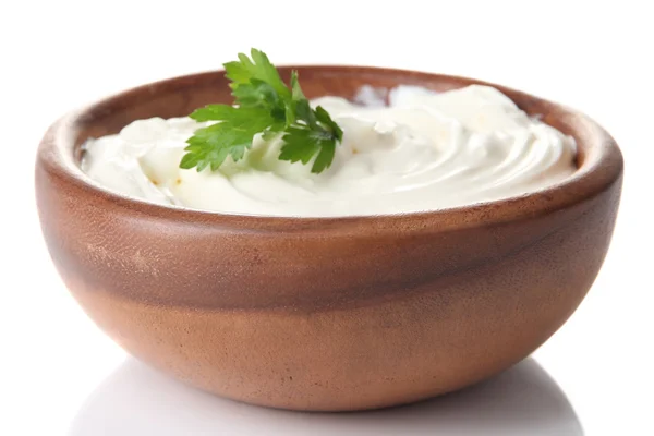 Sour cream in bowl isolated on white — Stock Photo, Image