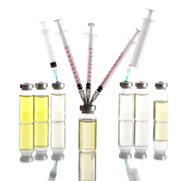 Medical bottles and syringes isolated on white — Stock Photo, Image