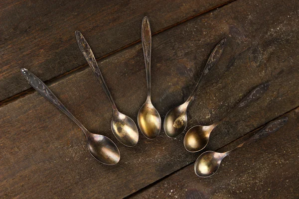 Vintage metal spoons on wooden table close-up — Stock Photo, Image