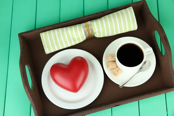 Wooden tray with breakfast, on color wooden background — Stock Photo, Image