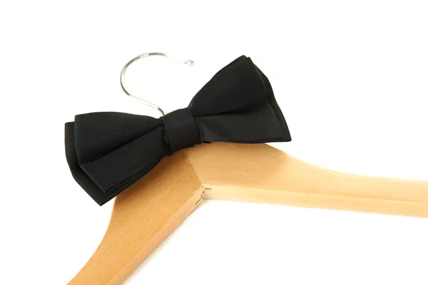 Black bow tie on wooden hanger, isolated on white — Stock Photo, Image