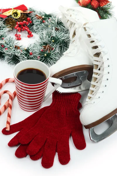 Figure skates with cup of coffee isolated on white — Stock Photo, Image