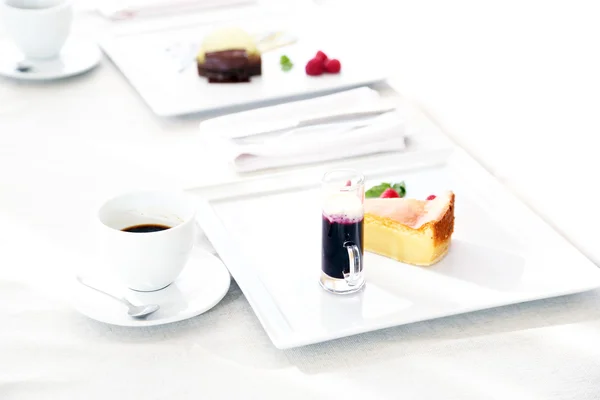 Tasty desserts on white plate, at restaurant — Stock Photo, Image