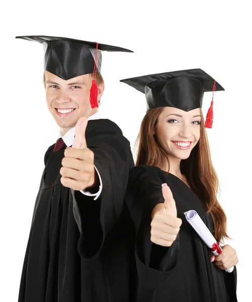 Dos estudiantes graduados felices aislados en blanco Imagen De Stock