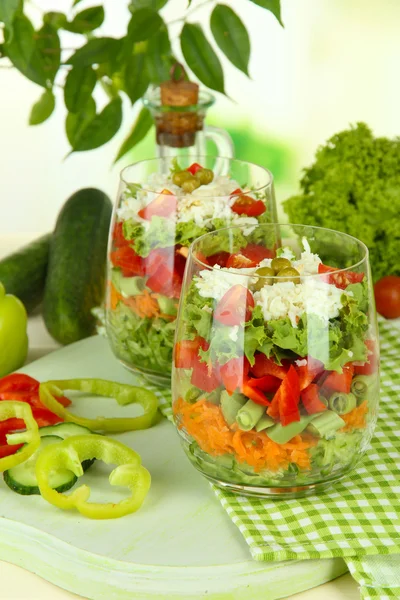 Tasty salad with fresh vegetables on wooden table Royalty Free Stock Images