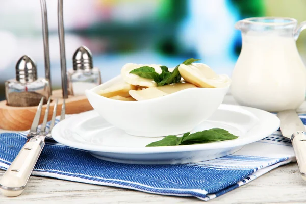 Tasty dumplings on white plate, on bright background — Stock Photo, Image