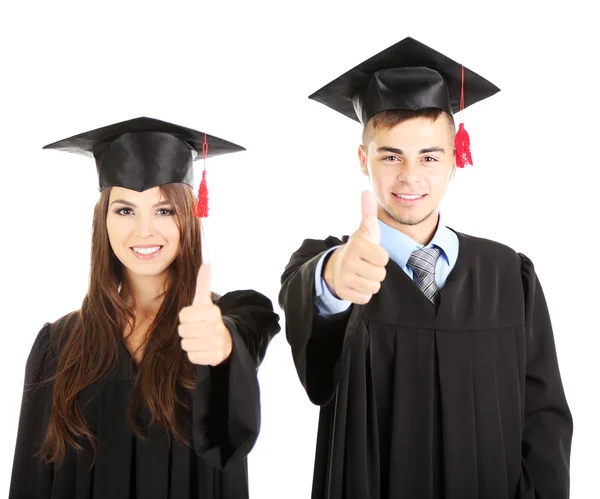 Twee gelukkige afstuderen studenten geïsoleerd op wit — Stockfoto