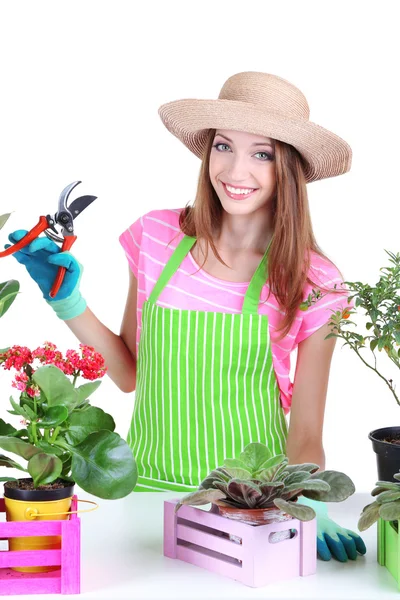 Jardineiro menina bonita com flores isoladas em branco — Fotografia de Stock