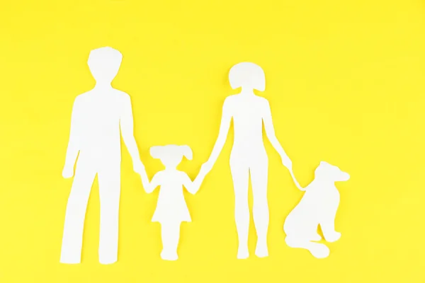 Family from paper on bright background — Stock Photo, Image