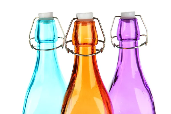 Botellas coloridas aisladas en blanco — Foto de Stock