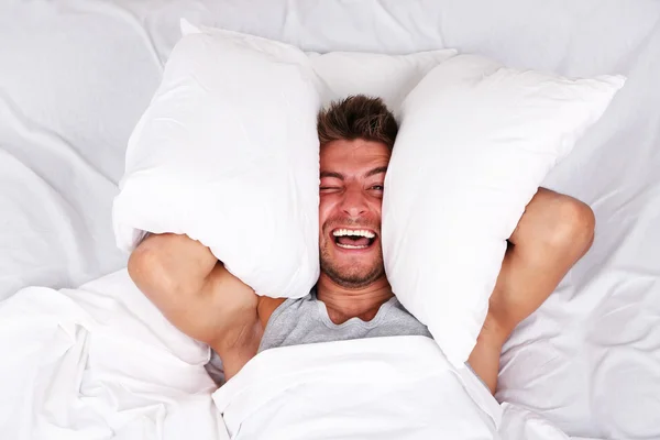 Handsome young man in bed — Stock Photo, Image