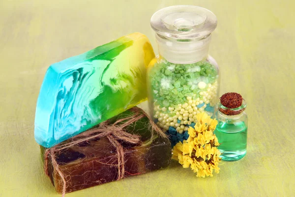 Hand made soaps with sea salt on wooden table close-up — Stock Photo, Image