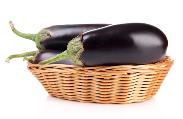 Fresh eggplants in wicker basket isolated on white — Stock Photo, Image