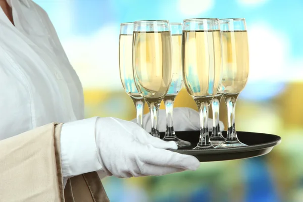 Waitresses holding tray with glasses of champagne — Stock Photo, Image