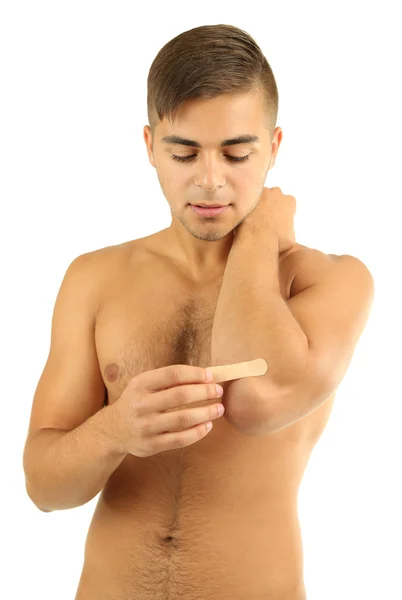 Young man with adhesive bandage on hand, isolated on white — Stock Photo, Image