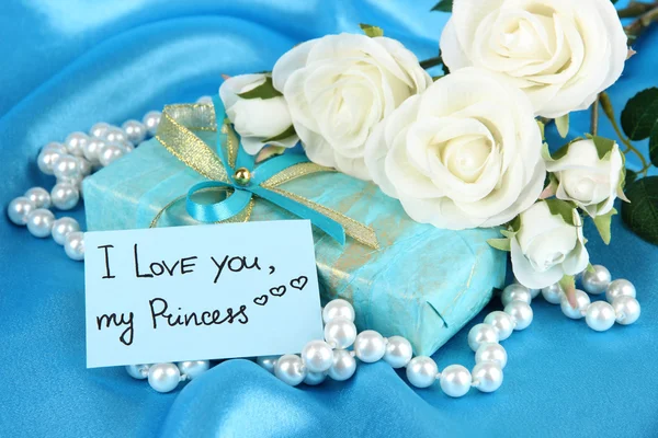 Romantic parcel on blue cloth background Royalty Free Stock Photos