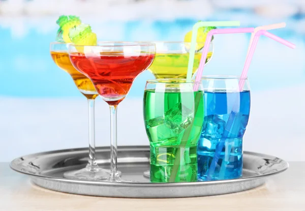 Different colorful cocktails on bright background — Stock Photo, Image