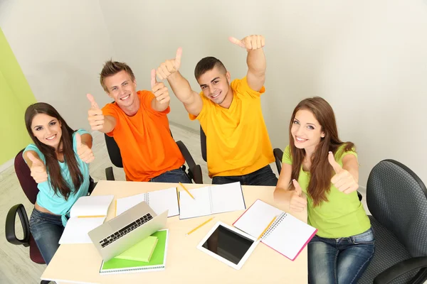 Group of young students sitting in the room — Stock Photo, Image