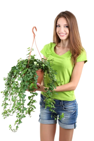 Hermosa chica con flor en maceta aislada en blanco — Foto de Stock