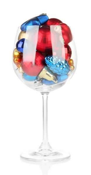 Wine glass filled with christmas decorations, isolated on white — Stock Photo, Image