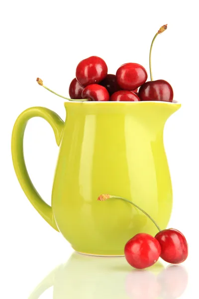 Ripe red cherry berries in pitcher isolated on white — Stock Photo, Image