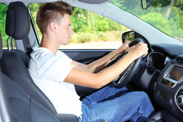 Young man in his new car — Stock Photo, Image
