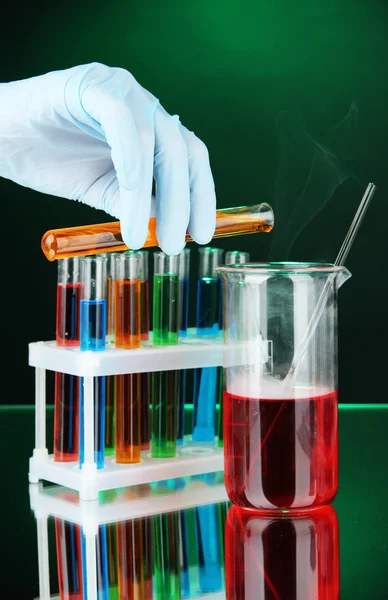 Laboratory glassware on dark color background — Stock Photo, Image