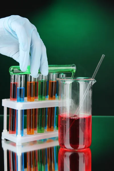 Laboratory glassware on dark color background — Stock Photo, Image