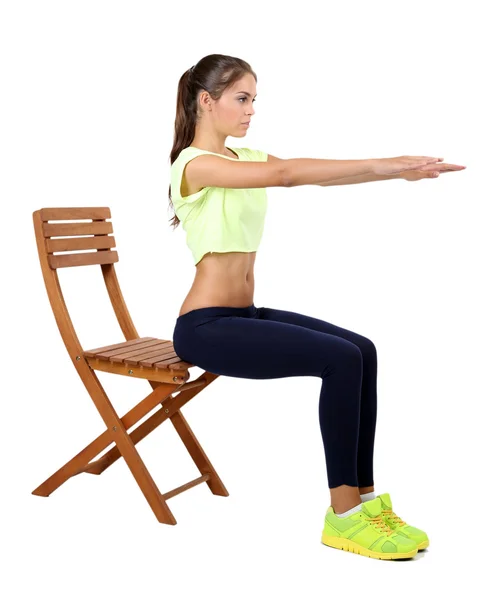 Menina bonita fazendo exercícios isolados no branco — Fotografia de Stock