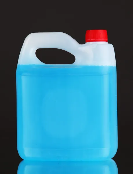 Blue liquid for car in canister on grey background — Stock Photo, Image