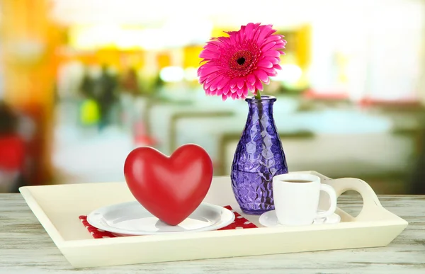 Wooden tray with breakfast, on color wooden table, on bright background — Stok fotoğraf