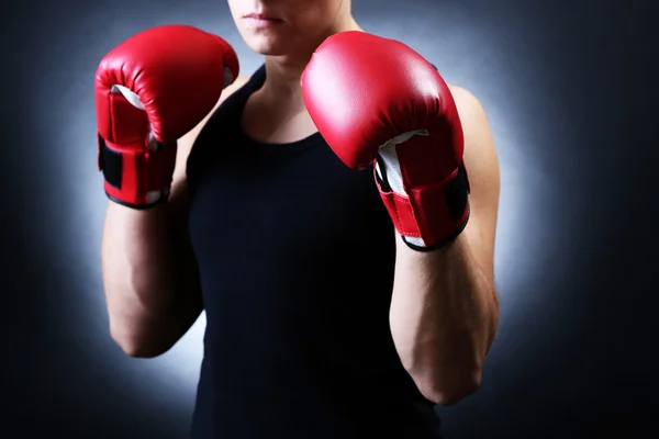 Handsome young muscular boxer on dark background — Stock Photo, Image