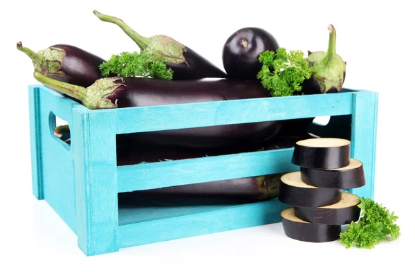 Fresh eggplants in wooden box isolated on white — Stok fotoğraf