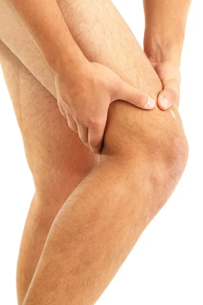 Młody człowiek z bólem kolana, na białym tle — Zdjęcie stockowe