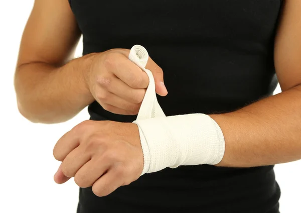 Young man with elastic bandage on hand, isolated on white — Stock Photo, Image