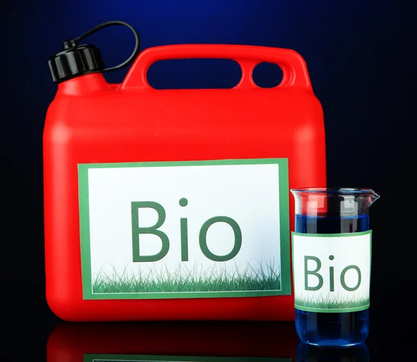 Bio fuels in canister and vials on blue background — Stock Photo, Image