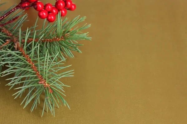 Christmas tree with beautiful New Year's berries on table — Stock Photo, Image